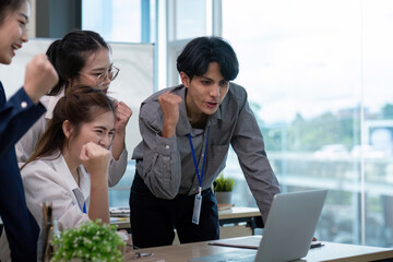 Dynamic Business Team Celebrating Success and Analyze Achievements in a Modern Office Environment