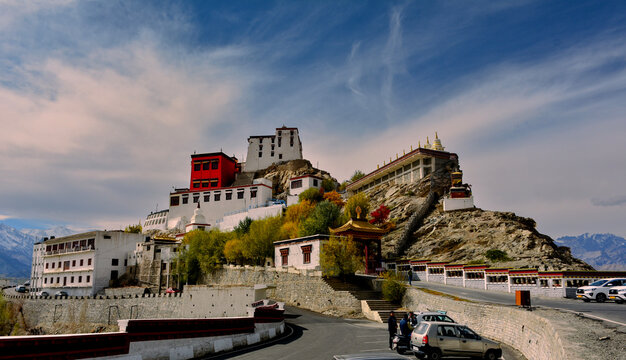 Thiksay monastery with view of Himalayan mountians and blue sky with white clouds in background,Ladakh,Jammu and Kashmir, India