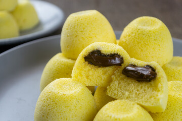 fresh homemade Bakpia Kukus Coklat or Steamed Bakpia Cake with chocolate filling. is one of Jogja's typical souvenirs. 