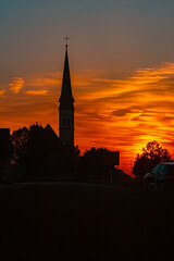 Sunset with a church silhouette near Wallerdorf, Künzing, Deggendorf, Bavaria, Germany