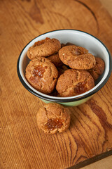 A bowl with pepas cookies on a table