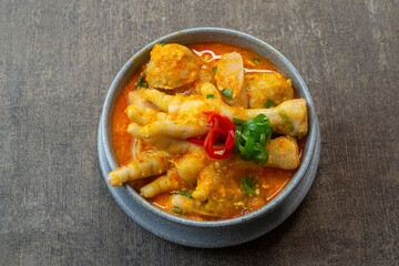 seblak ceker. Seblak is a typical Sundanese cuisine that has a spicy, savory and rich taste. Its uniqueness in the chewy wet crackers and rich spices. top view food