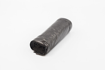 Black plastic garbage bags on white background, Roll of garbage bags on white background