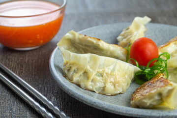 Kuotie, one of the Chinese snacks, is a type of dimsum with various meat and vegetable fillings...