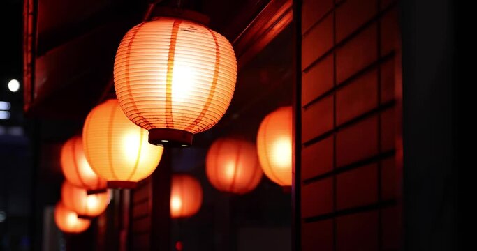 A night neon cityscape including the paper lantern at the downtown in Tokyo close up