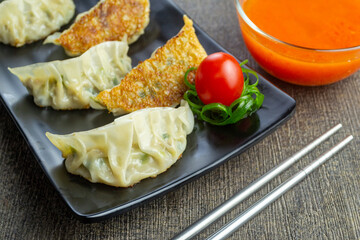 Kuotie, one of the Chinese snacks, is a type of dimsum with various meat and vegetable fillings Usually a meal at family gatherings during Chinese New Year celebrations