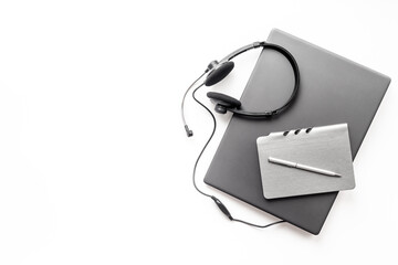 Call center operator desktop, customer service help with headphones headset and laptop
