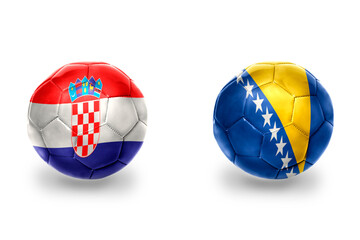 football balls with national flags of bosnia and herzegovina and croatia ,soccer teams. on the...
