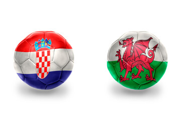 Obraz premium football balls with national flags of wales and croatia ,soccer teams. on the white background.