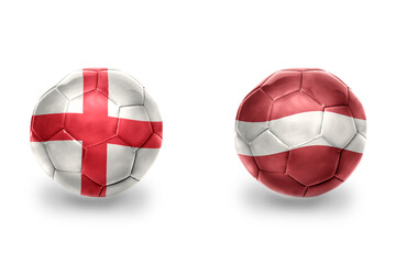 Obraz premium football balls with national flags of england and latvia ,soccer teams. on the white background.