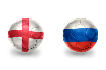 Obraz premium football balls with national flags of england and russia ,soccer teams. on the white background.