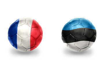 football balls with national flags of france and estonia ,soccer teams. on the white background.