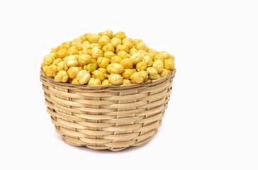 Closeup of Roasted Garbanzo Bean or Chickpea in a Bamboo Bowl Isolated on White Background with Copy Space, Also Known as Bengal Gram or Egyptian Pea