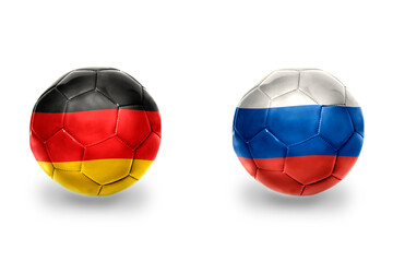 Fototapeta premium football balls with national flags of germany and russia ,soccer teams. on the white background.