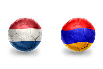 football balls with national flags of armenia and netherlands ,soccer teams. on the white background.