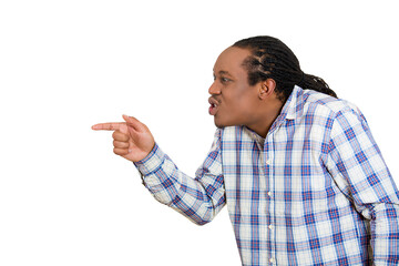 Closeup side portrait, headshot handsome young unhappy man, looking angry, agitated, pointing with finger, isolated white background.