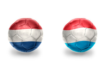 Fototapeta premium football balls with national flags of luxembourg and netherlands ,soccer teams. on the white background.