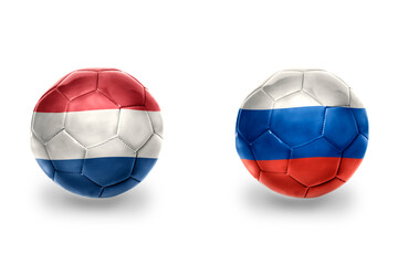 Obraz premium football balls with national flags of russia and netherlands ,soccer teams. on the white background.