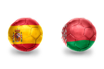 Fototapeta premium football balls with national flags of spain and belarus ,soccer teams. on the white background.