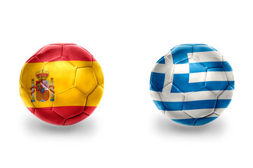 Obraz premium football balls with national flags of spain and greece ,soccer teams. on the white background.
