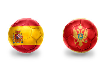 football balls with national flags of spain and montenegro ,soccer teams. on the white background.