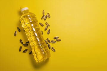 A plastic bottle filled with vegetable oil in close-up on a colored background