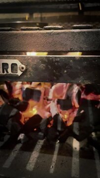 Hot embers burning on an parrilla barbecue grill