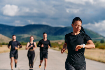 Leader Guiding Athletes on a Sunny Day Run