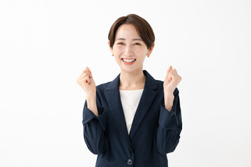 ガッツポーズをする女性