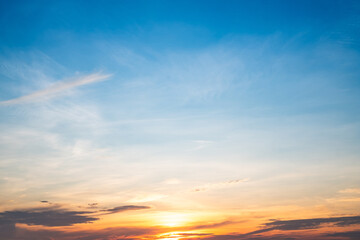 Obraz premium Beautiful , luxury soft gradient orange gold clouds and sunlight on the blue sky perfect for the background, take in everning,Twilight, Large size, high definition landscape photo
