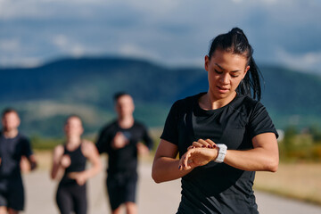Leader Guiding Athletes on a Sunny Day Run