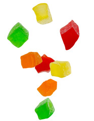 Colored candied fruits fall in space. Volumetric back light. Isolated on white.