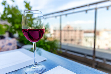 Glass of red wine cocktail on the table