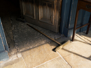 Discarded Broom in a door way