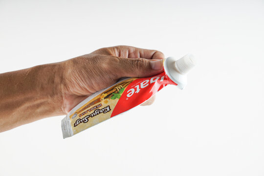 Kota Kinabalu, Sabah. Malaysia. squeeze the toothpaste bottle