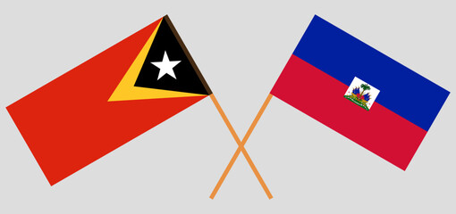 Crossed flags of East Timor and Haiti. Official colors. Correct proportion