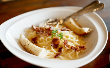 Spaghetti carbonara with bacon in a cream sauce.