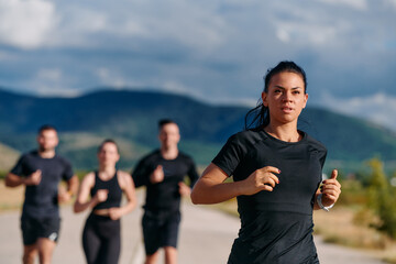 Leader Guiding Athletes on a Sunny Day Run