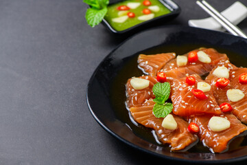 Pickled Salmon with Soy Sauce with chilli and garlic on stone background,
