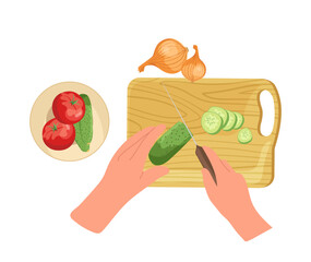 Chef hand chopping fresh cucumber on cutting board for salad with tomatoes and onion view from above