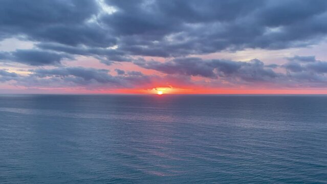 Spectacular sunrise video with the sun rising from the sea