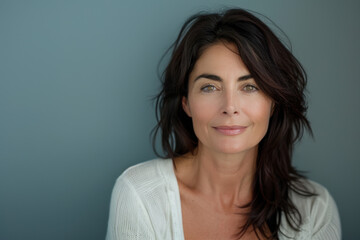 Fototapeta premium A close up portrait of a woman with a subtle smile