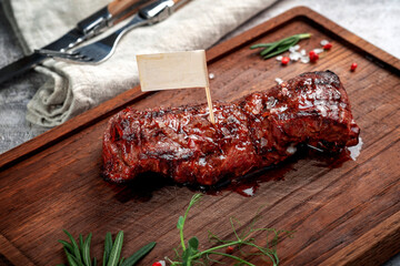 A juicy grilled skirt steak, or diaphragm steak, is displayed on
