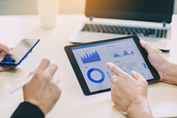 Two businessman consult SWOT analyzing company financial cash flow result. Concept of teamwork business meeting for team corporate strategy and economy finance fund.