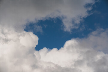 Photo background texture of cumulus clouds in the sky, close-up photo.