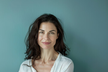 A close up portrait of a woman with a subtle smile