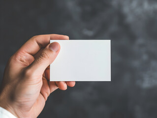 Hand-holding blank business card mockup