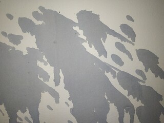 Gray abstract stain background. Stains on the wall
