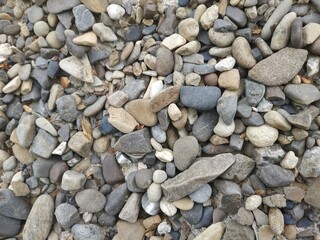 gray natural stone texture background. river stone