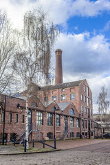 Merchant's Quay is a former textile mill complete with towering chimney that made it a landmark in Shipley West Yorkshire and has now been converted into office spaces